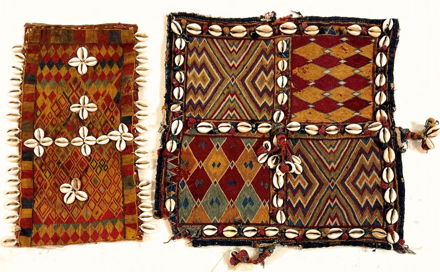 Ancient cowrie-shell embroidered textile talismans